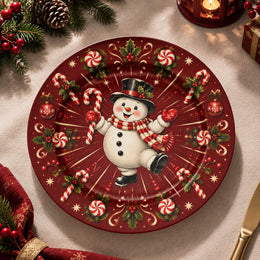 Red charger plate with gold trim featuring a snowman between radiating candy canes and snowflakes