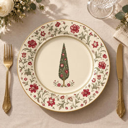 Cream charger plate with gold trim featuring a vintage tree framed by a trailing rose border