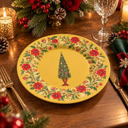 Golden charger plate with gold trim featuring a vintage tree in a wreath of red carnations