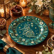 Teal charger plate with gold trim featuring Arabic calligraphy in a lantern and blossom ring