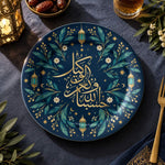 Navy blue charger plate with gold trim featuring calligraphy beside a crescent and hanging lanterns