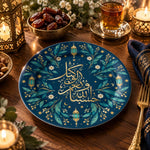 Navy blue charger plate with gold trim featuring calligraphy beside a crescent and hanging lanterns