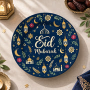 Navy charger plate with gold trim featuring Eid script, lanterns and star medallions
