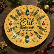 Golden charger plate with gold trim featuring Eid script among radiating leaves and a lantern