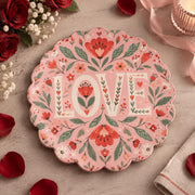 Pink scalloped plate with cream LOVE letters between coral tulips