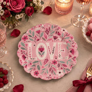Pink scalloped plate with floral cream LOVE letters among pink blooms