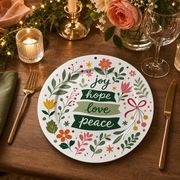 * Elegant Christmas dinner table setting featuring the holly berry charger plate under a white ceramic dinner plate.