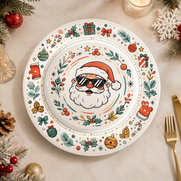 * Flat lay of a Christmas decorative charger plate with a festive holiday design on a clean white base.