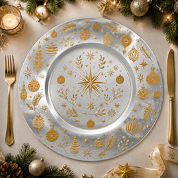 * Elegant silver Christmas charger plate with festive winter patterns on a clean background.