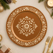 Symmetrical copper and cream folk art wedding charger plate with radiating central floral medallion design.