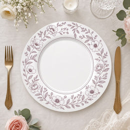 * Elegant white wedding charger plate featuring a delicate floral pattern around the rim, top-down view.