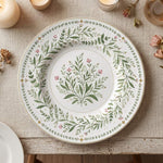 * Minimalist white charger plate with a delicate gold rim, showing the flat, elegant top-down design.