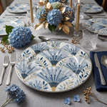 * Elegant clear glass charger plates styled on a modern dinner table with white linens and polished cutlery.