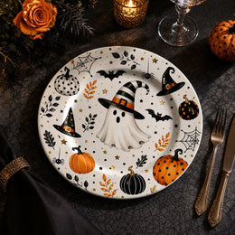 * Minimalist white charger plate with abstract black and grey paint stroke design, flat top-down view.