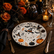 * Modern white decorative plate styled on a minimalist wooden dining table with linen napkins and cutlery.