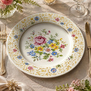 * Vintage floral charger plate featuring a pink rose bouquet, wildflowers, and an intricate gold scrollwork rim on cream.