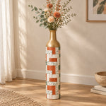 Indigo Weave Metal Flower Vase – Terracotta Leaf Stripe decorative metal vase shown in a styled room scene.