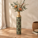 Cobalt Roundel Metal Flower Vase – Olive Rust Medallion decorative metal vase shown in a styled room scene.