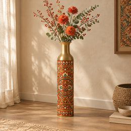 Saffron Meena Metal Flower Vase – Brick Rust Pigment Bloom decorative metal vase shown in a styled room scene.