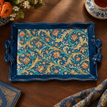 Deep blue tray with gold trim featuring gold scrollwork and calligraphy on a deep blue ground
