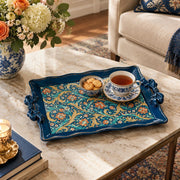 Deep blue tray with gold trim featuring gold scrollwork and calligraphy on a deep blue ground