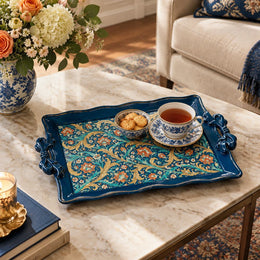 Deep blue tray with gold trim featuring gold scrollwork and calligraphy on a deep blue ground