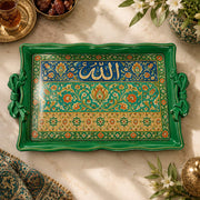 Emerald green tray with gold trim featuring calligraphy above a floral band on a green ground