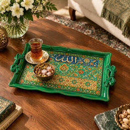 Emerald green tray with gold trim featuring calligraphy above a floral band on a green ground