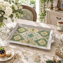 Warm ivory tray with gold trim featuring a cream medallion of blossoms inside a fine gold keyline