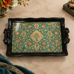 Black tray with gold trim featuring teal and gold florals carpeting a black ground
