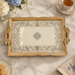 Warm cream tray with gold trim featuring a blue and gold baroque scroll border