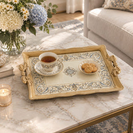 Warm cream tray with gold trim featuring a blue and gold baroque scroll border