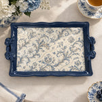 Cream tray with gold trim featuring trailing blue floral vines and small blossoms