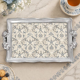 Silver white tray with gold trim featuring a dense repeat of blue flowering sprigs