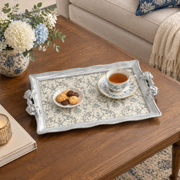 Silver white tray with gold trim featuring a dense repeat of blue flowering sprigs