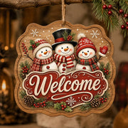 Welcome Snowmen MDF Wood Hanging Wall Decor – Pine hanging wall decor with printed artwork and cut silhouette.