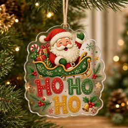 Clear acrylic knit Santa in vintage green sleigh wall decor with HO HO HO letters, gift boxes, candy cane, and holly.