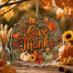 Give Thanks Acrylic Hanging Wall Decor – Pumpkin & Fall Leaves clear acrylic hanging wall decor with back-printed illustration, scalloped die-cut silhouette, hung with natural jute twine.