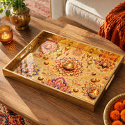 Diwali Lotus Mandala Decorative Tray with Diyas - Minti Home on a coffee table, featuring UV-printed artwork on tempered glass with an electroplated frame and matching handles.