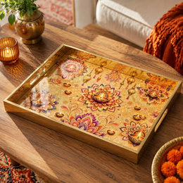 Diwali Lotus Mandala Decorative Tray with Diyas - Minti Home on a coffee table, featuring UV-printed artwork on tempered glass with an electroplated frame and matching handles.
