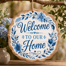 Welcome To Our Home MDF Wood Hanging Wall Decor – Blue Floral clear acrylic hanging wall decor with back-printed illustration, scalloped die-cut silhouette, hung with natural jute twine.