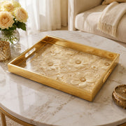 White Embroidered Floral Gold Decorative Tray with Couture Petals and Gold Frame | Minti Home on a coffee table, featuring UV-printed artwork on tempered glass with an electroplated frame and matching handles.
