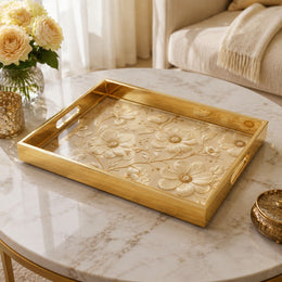 White Embroidered Floral Gold Decorative Tray with Couture Petals and Gold Frame | Minti Home on a coffee table, featuring UV-printed artwork on tempered glass with an electroplated frame and matching handles.