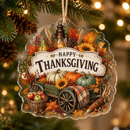 Rustic Thanksgiving acrylic hanging decor with pumpkins, wheat, lantern, and an apple basket on a wooden wheelbarrow.