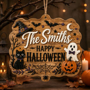 The Smiths Happy Halloween MDF Wood Hanging Wall Decor clear acrylic hanging wall decor with back-printed illustration, scalloped die-cut silhouette, hung with natural jute twine.