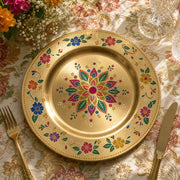 Decorative charger plate on a linen table.