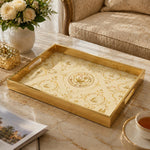 State of Qatar Glass Serving Tray – Gold Scrollwork Crest on a coffee table, featuring UV-printed artwork on tempered glass with an electroplated frame and matching handles.