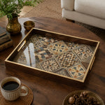 Moroccan Tile Decorative Tray with Dark Wood Frame and Gold Handles | Minti Home on a coffee table, featuring UV-printed artwork on tempered glass with an electroplated frame and matching handles.