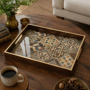 Moroccan Tile Decorative Tray with Dark Wood Frame and Gold Handles | Minti Home on a coffee table, featuring UV-printed artwork on tempered glass with an electroplated frame and matching handles.