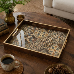 Moroccan Tile Decorative Tray with Dark Wood Frame and Gold Handles | Minti Home on a coffee table, featuring UV-printed artwork on tempered glass with an electroplated frame and matching handles.